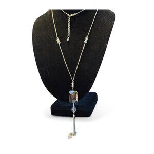 Beautiful and dramatic crystal glass pendant on a 21 inch chain.  Lovely draped